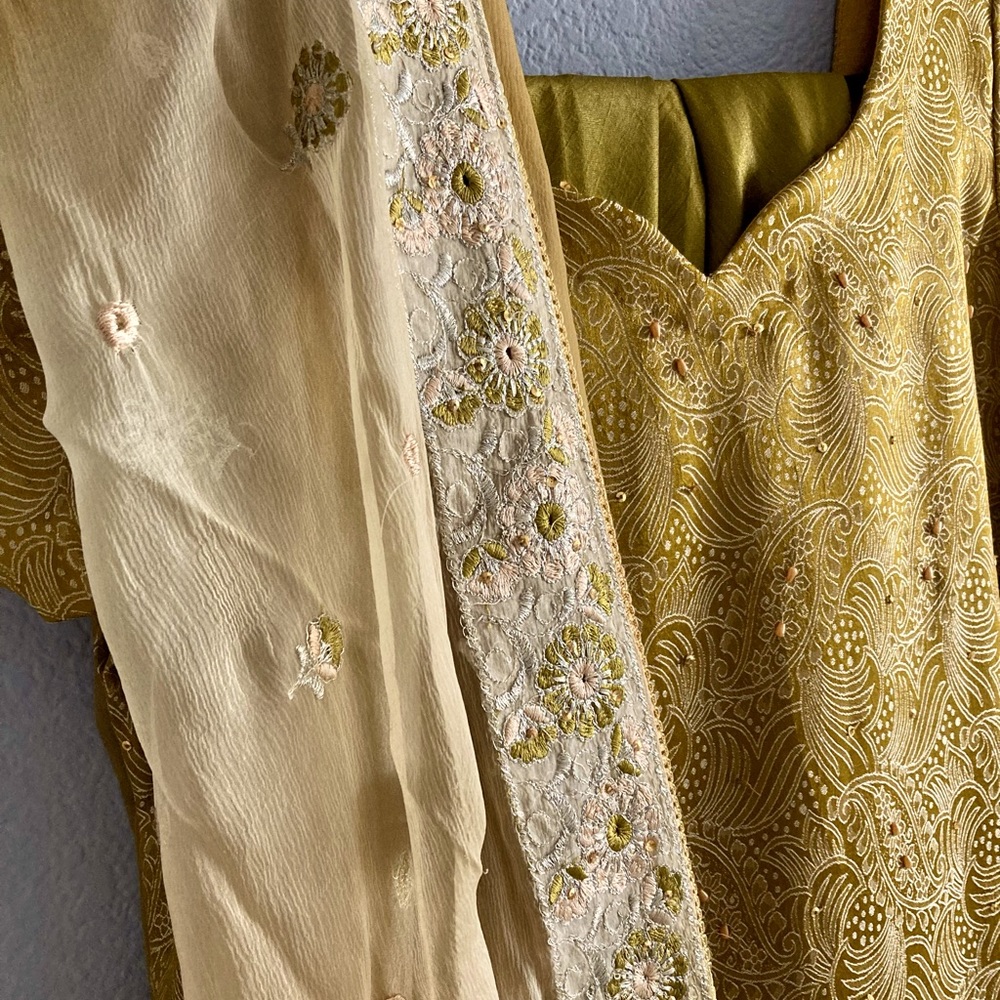 Mustard colored lehenga set with hand beading.